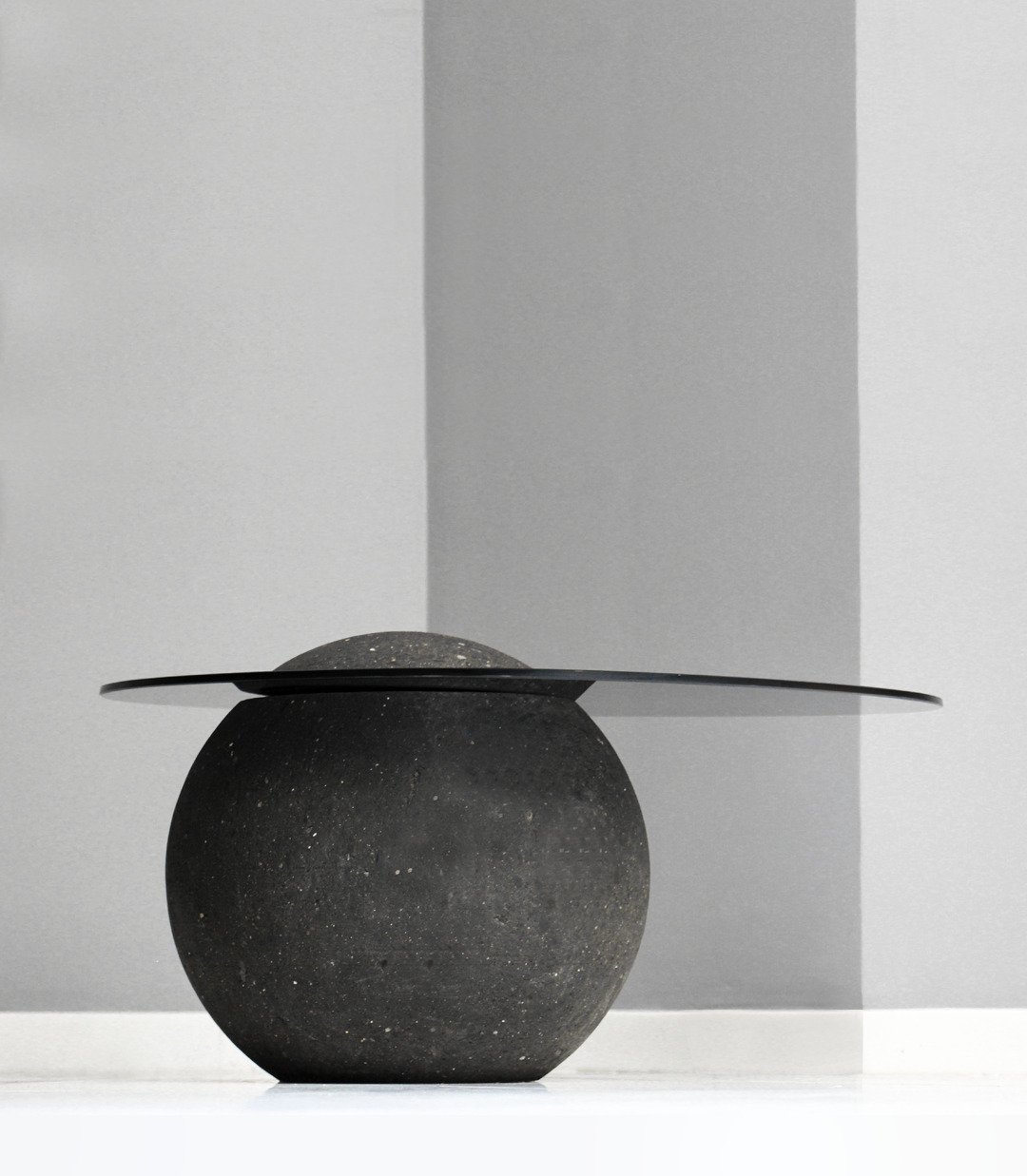 Cuitzeo Side Table by Drusch Design, hand carved dark gray volcanic cantera stone and 9 mm smoked tempered glass